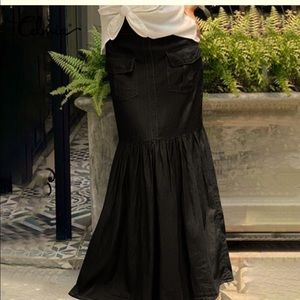 Black denim maxi skirt.  New with tags.  Tag says XL. It looks to be a Medium.